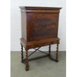 Walnut and feather-banded secretaire abbattant cabinet, repaired all front opening to reveal a