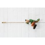 Novelty painted wooden clown figure, modelled climbing a rope, 30cm