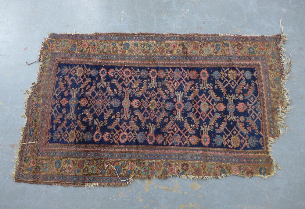 North West Persian rug, indigo field, a/f with losses from the end 195 x 116cm