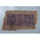 North West Persian rug, indigo field, a/f with losses from the end 195 x 116cm