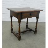 An oak side table, rectangular top with rounded edge, a single frieze drawer, on baluster legs