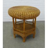 A vintage wicker table, circular with an undertier, 61 x 62cm.