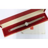 Lady's vintage 9ct white gold Omega wrist watch on a 9ct gold bracelet strap, complete with box