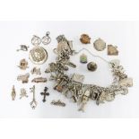 Vintage silver charm bracelet with a heart shaped padlock together with a quantity of loose charms