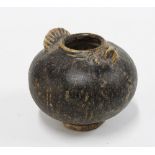 Small brown glazed globular lime pot, modelled in the form of an owl, likely early Cambodian, 7cm