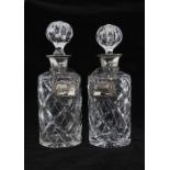 A pair of silver mounted glass spirit decanters, Birmingham 1978 with Epns Whisky & Sherry