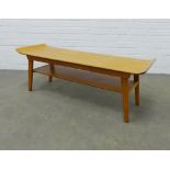Mid Century surfboard top coffee table, with undertier and outswept legs, 112 x 39 x 38cm.