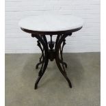 Early 20th century table, circular hardstone top on four outswept legs, 71 x 76cm.
