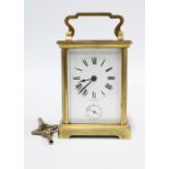 French carriage clock of small proportions, complete with key, 13cm high including handle