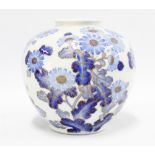 Japanese Meiji Period Fukagawa vase, the white ground decorated with blue flowers, 19cm