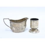 Edwardian silver egg cup, Birmingham 1908 and a small silver milk jug, Sheffield 1903 (2)