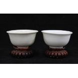 Two Chinese white glazed tea bowls, one bearing a Chenghua mark the other likely Fukien Province,