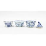 Three Chinese blue and white shipwreck tea bowls, circa 1609, tallest 4cm, together with a foo dog