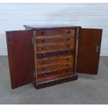19th century collectors cabinet, with two flame mahogany doors, opening to reveal seven long drawers