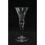 An 18th century wine glass with tear drop to the stem, 16cm high