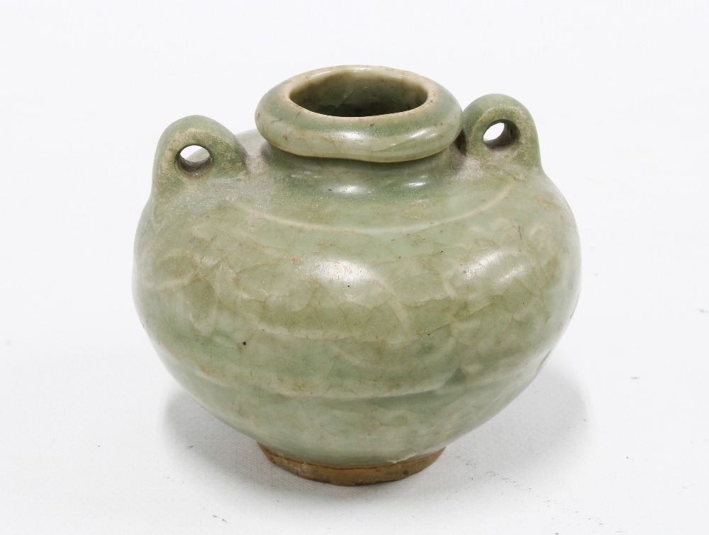 Chinese Yuan celadon glazed jarlet with loop handles to the shoulders. 7cm high. Provenance: Private