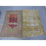 Two Eastern rugs, to include one with a worn golden field, together with another 170 x 112cm, both