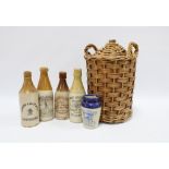 Stoneware jar in wicker cover, 33cm, together with four vintage Ginger Beer stone bottles and a