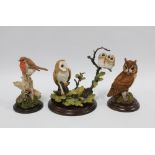 Three Country Artists figures, including 'Long Eared Owl' CA394, 'Barn Owl with Oak Leaves' CA358,