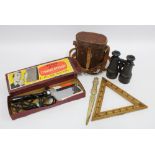 Early 20th century binoculars in a leather case, together with a vintage electric trouser press,