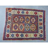 Eastern rug, with kazak medallions and rosette border, a/f with repairs, 168 x 125cm
