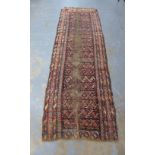 Persian runner, worn red field, a/f with wear and holes, 340 x 106cm