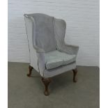 19th century upholstered walnut wing armchair in the George II style with shell carved cabriole