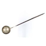19th century white metal toddy ladle, the bowl with swirling pattern, with twisted baleen handle,
