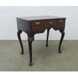 19th century oak lowboy of typical design with three frieze drawers, standing on cabriole legs, 77 x