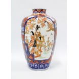 Japanese Imari baluster vase decorated with figural panels, (chip to top rim) 30cm high