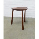 Vintage Thebes style stool with shaped set and three stylised legs, 39 x 46 x 26cm.