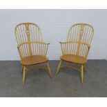 A pair of Ercol swan back Windsor armchairs with crinoline stretcher 61 x 107 x 44cm. (2)