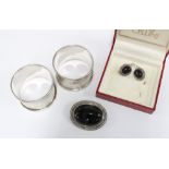 Silver and black onyx earrings and brooch together with two silver napkin rings (4)