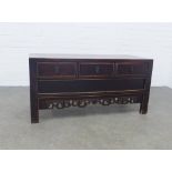 Chinese low cabinet with three drawers and a pierced apron, 107 x 52 x 43cm.
