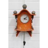 Stonesplitter 'mouse' wall clock, orange craquelure glaze with white dial, surmounted with three
