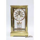 Brass and four glass panelled mantle clock, enamel chapter ring with Roman numerals, mercury