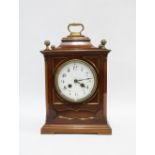 Mahogany cased bracket clock with brass finials and carry handle, above enamel dial with Arabic