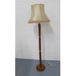 An Art Deco style oak standard lamp, 182cm.