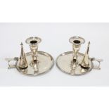 A pair of Georgian silver chamber candlesticks complete with matching snuffers and a detachable