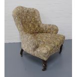 Button back upholstered armchair, with brass caps and castors, 70 x 85 x 60cm.