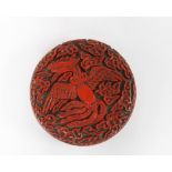 Chinese carved cinnabar cosmetic box and cover, circular with phoenix pattern, 6cm diameter