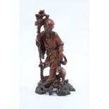 A well carved Chinese figure of an Immortal on a pierced base, height including base18cm