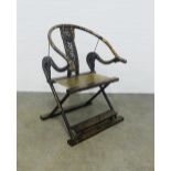 Chinese black and gilt Ming style folding armchair, horseshoe back and woven seat, 77 x 111 x 40cm.