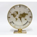 Kienzle brass framed mantle clock, the silvered dial with a map of the world, 30cm high