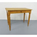 Pine table, rectangular top over a central frieze drawer, on turned baluster legs, 92 x 73 x 51cm.