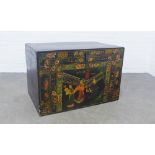 Chinese blanket box, the ebonised exterior painted with figures and flowers, 89 x 59 x 56cm.