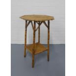 Vintage bamboo table, octagonal top with an undertier and splayed legs, 47 x 72cm.