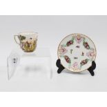 Naples porcelain cup and saucer decorated in relief with figures, dog and landscape, blue