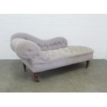 Scroll end chaise-lounge, with button back grey upholstery, on mahogany legs with brass caps and