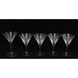 Set of four martini glasses with spiral twist bowls together with another with geometric pattern (5)